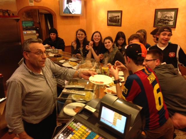 Students eating tapas with Don Fidel. 