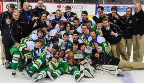 Anthony Walsh poses with his team after their state championship victory in 2013