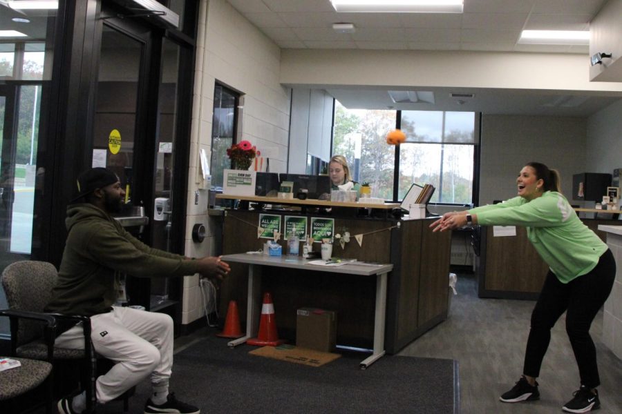 Photo By: Max Froehlich. Isari plays makeshift volleyball in the front office.