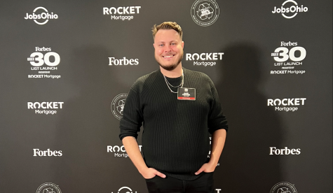 Alec Fischer smiles while attending the Forbes 30 under 30 launch party.