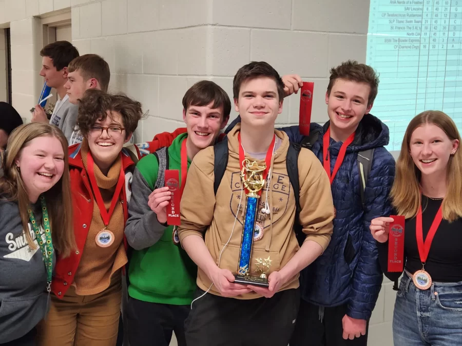 Edinas Knowledge Bowl team poses with a trophy after qualifying for state. 