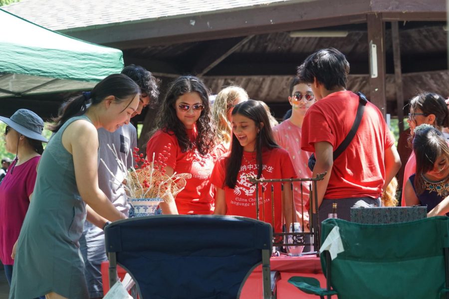 EHS students explore tables at the AAPI festival dedicated to lettering.