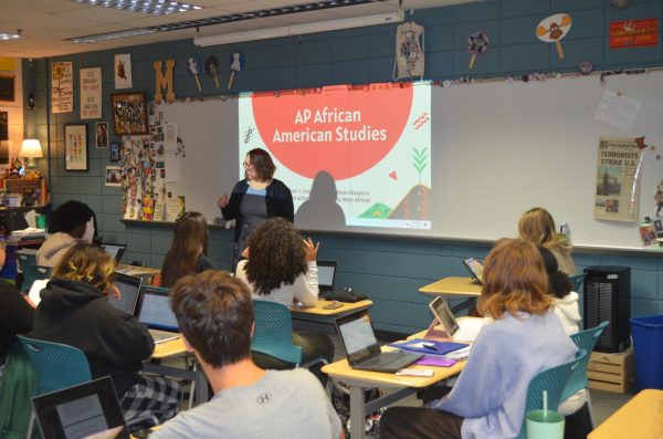 Mrs. Major, teacher of AP African American Studies, showing slideshow to her new class. 