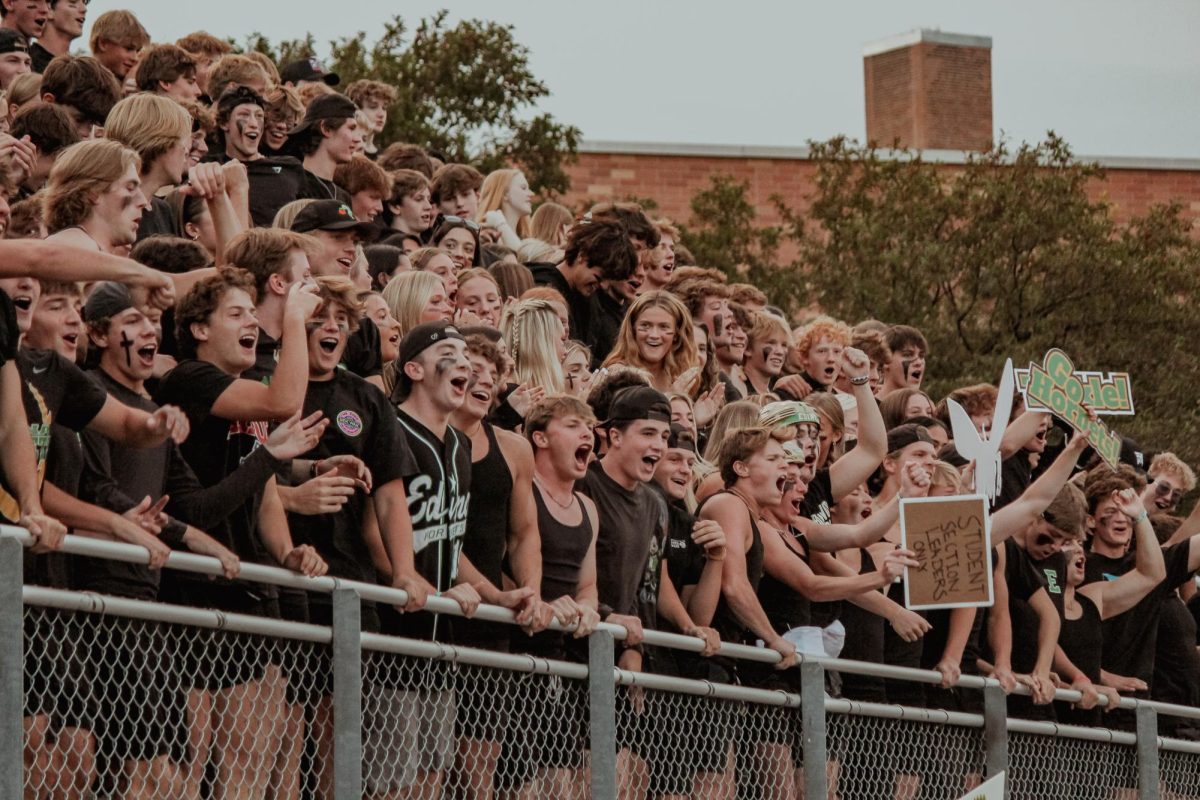 EHS+Student+Section+cheers+as+the+football+team+comes+out+to+the+field+to+play