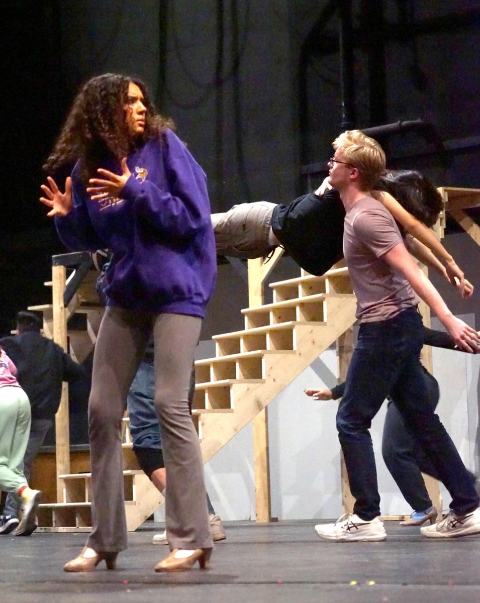 Senior Naomi Smith reacts in character to junior Will Jakala being carried off the stage in the casts rehearsal of Nice Work If You Can Get It on Nov 9, 2023.