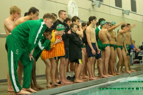 Edina Boys team cheering on swimmers during race on December 15th meet versus STMA at Art Downey Aquatic Center.  

“We practice for two hours Monday through Thursday. And then we get [to the meet location] a bit ahead of time and then do some more [practice before the meet],” senior captain Leo Mellum said, who swam the 200 IM and 100 Fly.

