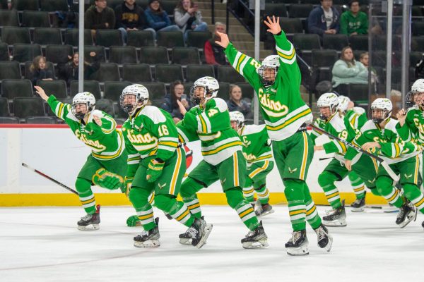 The Edina Girls Hockey team celebrates after securing the state championship title by defeating Hill-Murray 2-0.