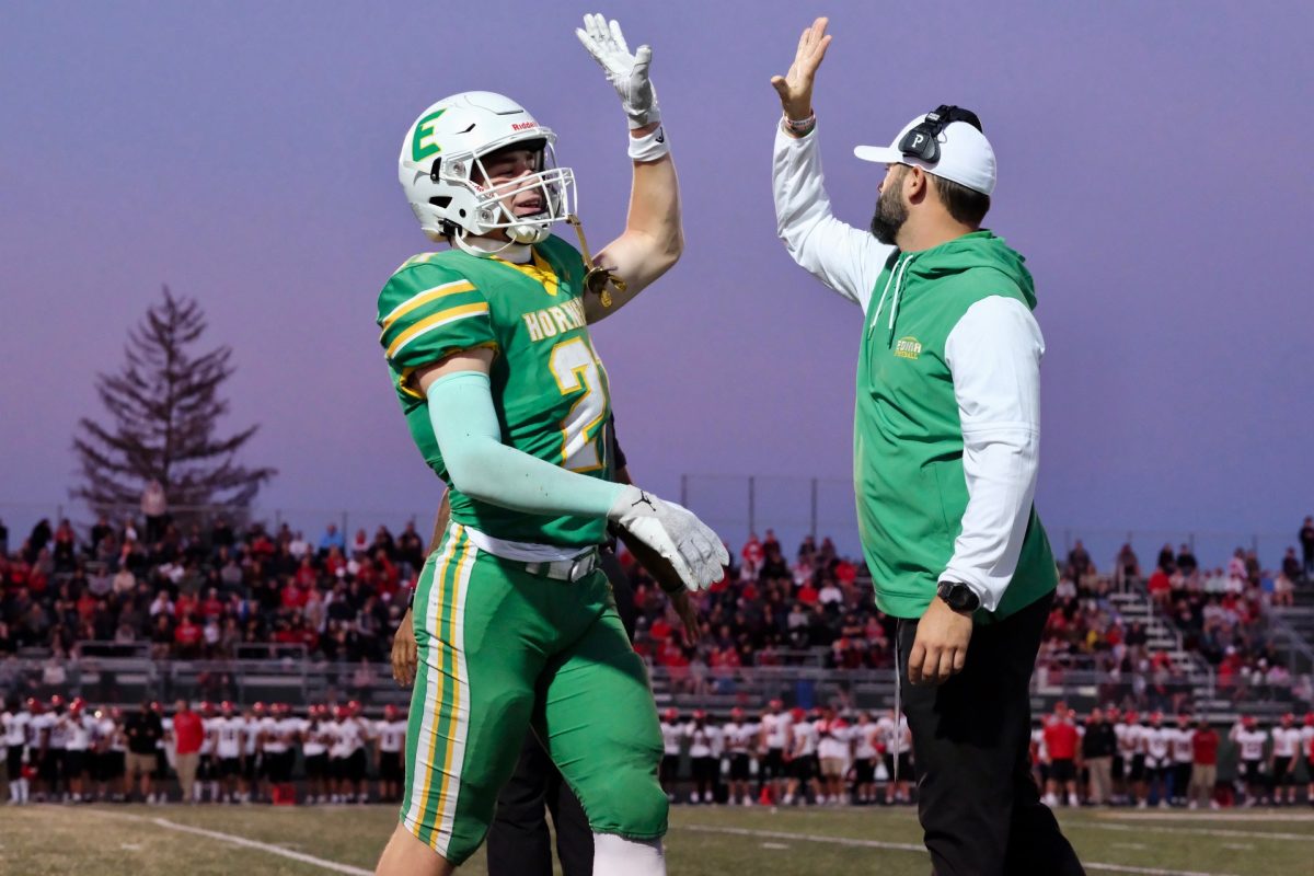 On Sept. 6, the Edina Boys' Football team played Eden Prairie at Kuhlman Field. After a play, Coach Josh Flug and Chase Bjorgaard celebrated with a high five.