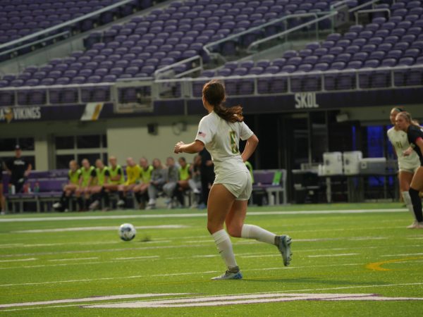 Senior forward Ally Adair runs to meet the ball during the Girls' MSHSL Class AAA Tournament semifinals against East Ridge.