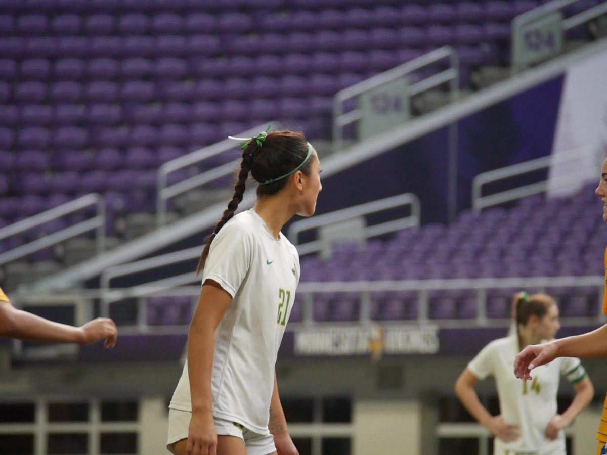 Senior midfielder Kaylee Idrogo-Lam surveys the field during a pause in play.