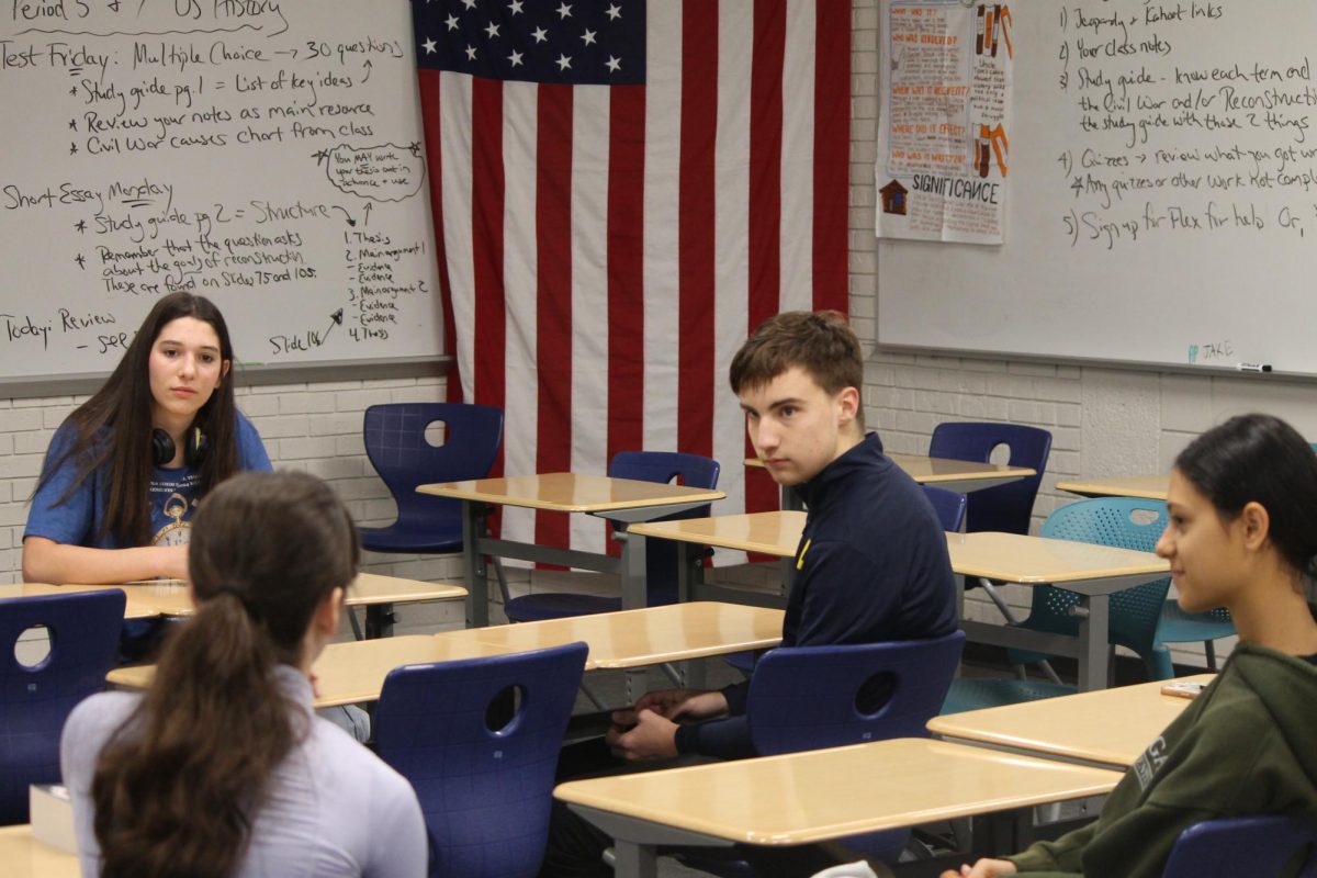 Members of the Political Science Club debate about the presidential nominees' policies.