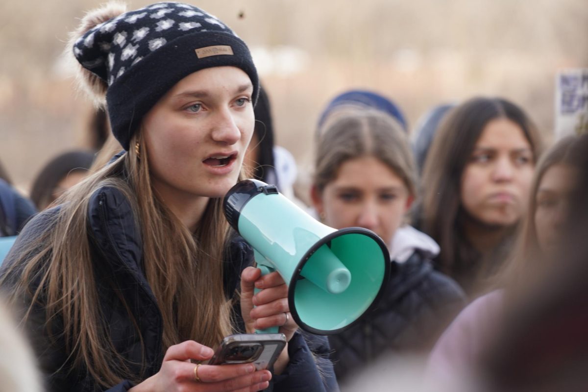 Sophomore and organizer Lucy Johnson delivered a speech about immigration enforcement during the walkout.