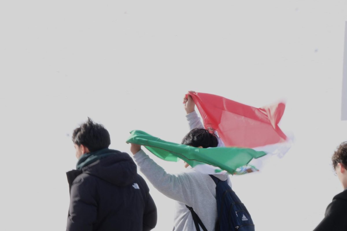 Students brought a Mexican flag to demonstrate support for those affected by ICE.