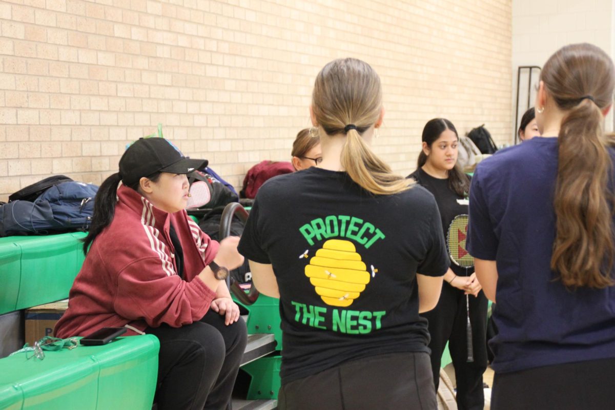 New badminton coach Zoe Chan strives to protect the state championship three-year streak.